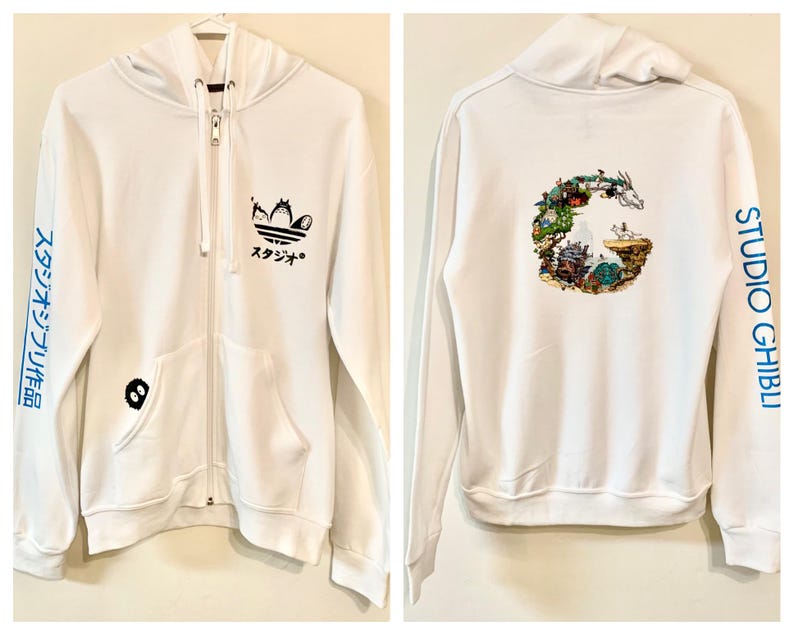 May include: White zip-up hoodie with a Studio Ghibli logo on the back and an Adidas logo on the front. The sleeves have the text "スタジオジブリ" in blue.