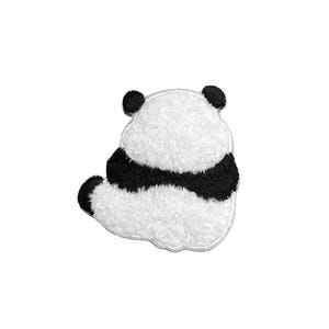 May include: A white and black panda bear patch with a textured, fuzzy surface. The panda is depicted from the back, showing its rounded ears, a thick black band across its midsection, and a small tail, all outlined with a stitched border.