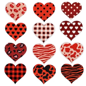 May include: A collection of twelve heart-shaped patches featuring various patterns including leopard print, black polka dots, white polka dots, black hearts, red and white gingham, white hearts, red leopard print, red zebra stripes, cow print, red plaid, black cow print, and black zebra stripes.