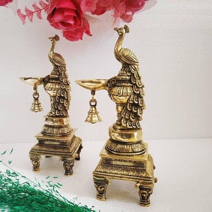 Peacock brass oil lamp pair