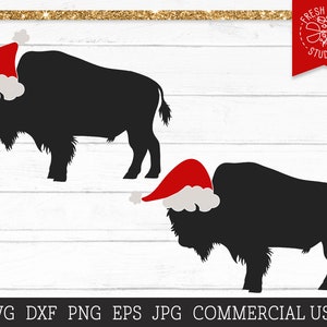 May include: A black silhouette of a bison wearing a red and white Santa hat. The image is set against a white woodgrain background.