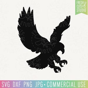 May include: A black silhouette of an eagle in flight, with outstretched wings and detailed talons. The image includes the text "FRESH CUTS STUDIO" and file type information: SVG, DXF, PNG, JPG, and "COMMERCIAL USE".