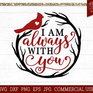 May include: A red cardinal bird perched on a black twig wreath with the text "I am always with you" in red cursive lettering.
