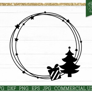 May include: Black Christmas wreath design with a gift box, Christmas tree, and stars. The design includes the text "SVG DXF PNG EPS JPG COMMERCIAL USE". The wreath is a circular shape with three concentric rings.