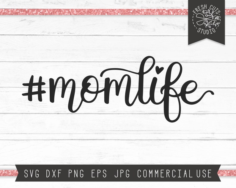 May include: Black and white graphic design with the text "#momlife" in a cursive font with a small heart above the "o".