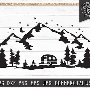 May include: Black and white silhouette of a camper van parked in front of a mountain range with a campfire and trees. The scene is set against a starry night sky with a crescent moon.