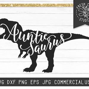 May include: A black Tyrannosaurus Rex silhouette with the white text "Auntie Saurus" across its body. The image also features the text "Fresh Cuts Studio" and file type information.