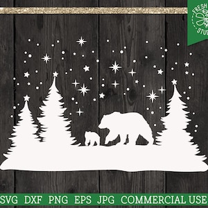 May include: A white silhouette design featuring a bear and cub walking through a forest of pine trees under a starry sky. The design includes the text "FRESH CUTS STUDIO" and "SVG DXF PNG EPS JPG COMMERCIAL USE".
