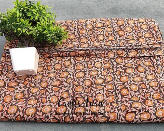 May include: Brown fabric with a white and orange floral print. The fabric is folded and has a white border. The text "Crafts Area Handmade With Love and Care" is visible in the bottom right corner.