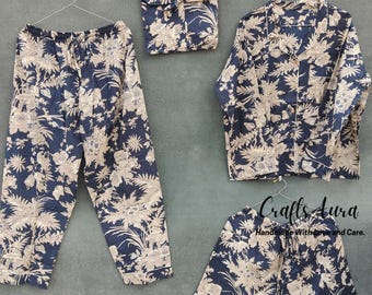 May include: A blue and cream floral pajama set with a long-sleeved top, pants, and shorts. The set is handmade with love and care.