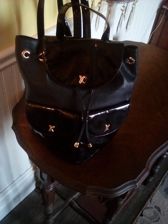 Paloma Picasso black leather backpack.