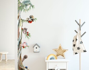 May include: A watercolor wall decal featuring a eucalyptus tree with various Australian animals, including a koala, a possum, a kookaburra, and an echidna. The decal is perfect for adding a touch of nature to a child's room.