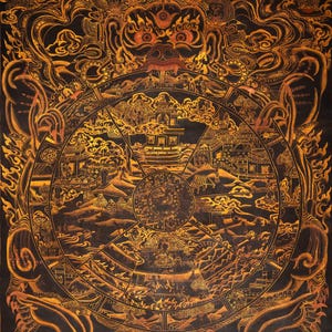 May include: A detailed, gold-colored illustration on a black background depicts a circular design with intricate figures and symbols. The artwork features a central wheel-like structure surrounded by various scenes and figures, with a large, ornate face at the top.