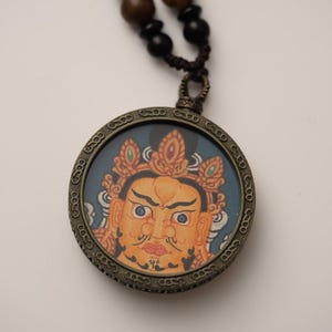 Zambala Thangka Round Locket – Sacred Symbol of Wealth, Abundance & Prosperity