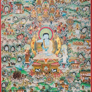 May include: A detailed, colorful Tibetan Buddhist thangka painting. The central figure is a blue-skinned deity, surrounded by numerous smaller figures, buildings, and landscapes. The artwork features intricate details, gold accents, and a red border, showcasing a rich cultural and religious theme.