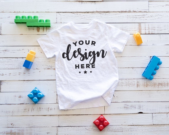 White Kids T Shirt Mockup With Blocks Flat Lay Kids Free Packaging Mockups Templates Psd File