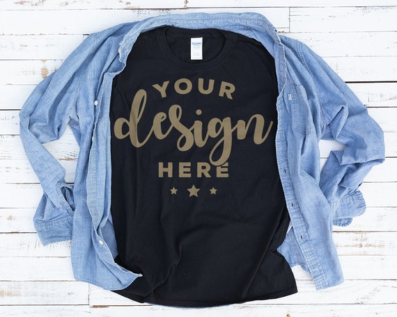 Black T-Shirt Mockup With Denim Shirt On Distressed Wood