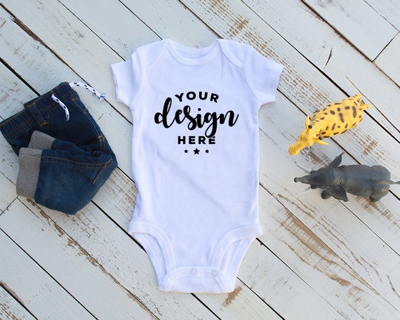 White Bodysuit Mockup With Infant Jeans And Safari Animals White Bodysuit Mockup With Infant Jeans And Safari Animals