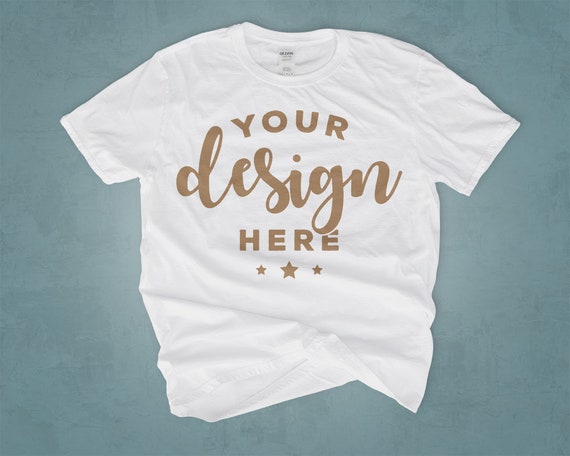 White T-Shirt Mockup On Blue Background 100 Percent Ring