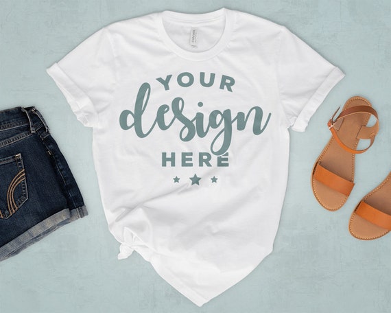 White Bella Canvas 3001 T-Shirt Mockup On Blue Background