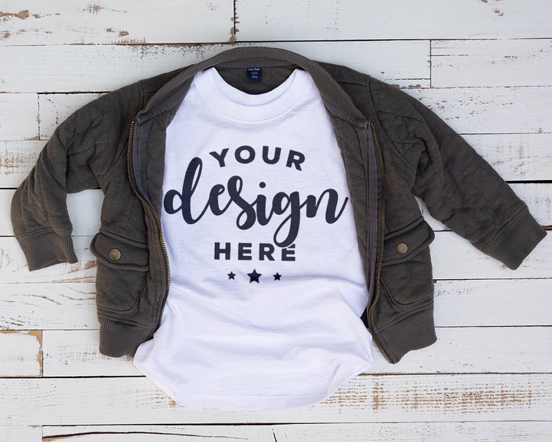 Download White Kids Tshirt Mockup With Jacket On Distressed Wood ...
