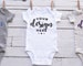 White Bodysuit Mockup Baby One Piece Template 3 Bodysuits Hanging From Clothesline Mock Flat Lay Shirt Template JPG Mockup 