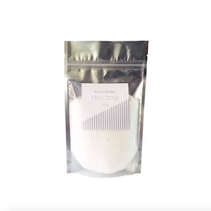 May include: A silver resealable pouch containing a white powder labelled "the love of colour FRUCTOSE 150g"