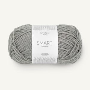 May include: A skein of gray yarn labeled "SMART - Superwash" by Sandnes Garn. The label also includes the text "Den Norske Garnfabrikken Siden 1888".