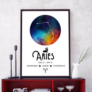 May include: A black and white print of the Aries star sign with a colourful galaxy background. The text "Aries" is in a bold, black font. The dates "MAR 21 - APR 19" are below the text. The words "Determined", "Leader", and "Courageous" are below the dates. A black and white symbol of the Aries star sign is below the words.