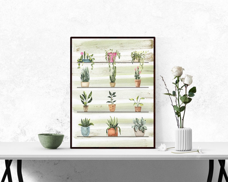 May include: A framed watercolor painting of a collection of potted plants on a shelf with a striped background. The plants are in various shades of green, with some pink and orange accents. The shelf is made of wood and has a rustic look.