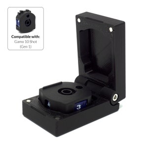 May include: Black plastic magazine case with a hinged lid, holding a circular magazine with blue and white markings. The text "Compatible with: Gamo 10 Shot (Gen 1)" is in the upper left corner.