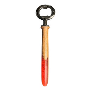 Hand Turned Bottle Opener with Red Resin featuring shimmering light hues.