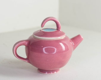 Small pink and colorful teapot for tea ceremony