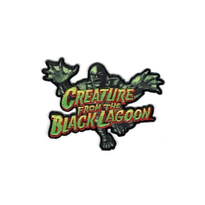 May include: Green embroidered patch featuring a creature from the black lagoon with the text "Creature from the Black Lagoon".