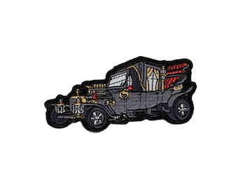May include: A black and gold vintage car with a red and gold interior. The car has a large, ornate roof and a single headlight on each side. The car is a cartoon illustration.