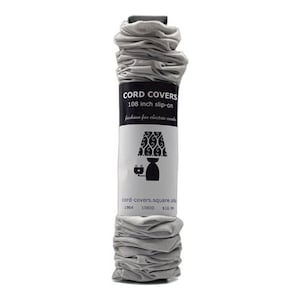 May include: Gray fabric cord covers for electrical cords, 108 inches long. The packaging shows a lamp with a patterned lampshade and the text "CORD COVERS 108 inch slip-on fashion for electric cords cord-covers.square.site 1984 10800 $16.99".