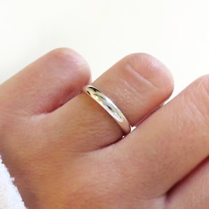 May include: A simple silver toe ring.
