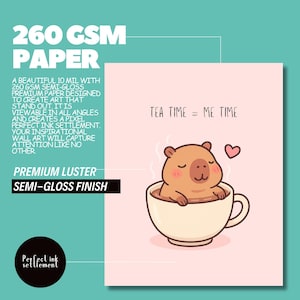 May include: A semi-gloss print featuring a cute cartoon capybara relaxing in a teacup, with the text "TEA TIME = ME TIME." The print is made with premium luster paper and has a 260 GSM weight.