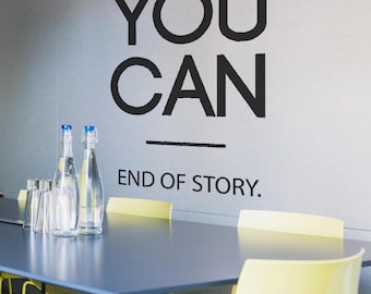 May include: A conference room scene with a dark blue table and yellow chairs. The wall features the text "YOU CAN" above "END OF STORY." Clear glass bottles and drinking glasses are on the table. The room has a modern, minimalist design.