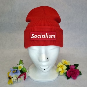 May include: Red beanie with a white "Socialism" patch on the front.