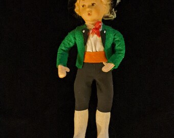 Singing boy in folk clothes