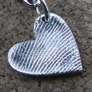 Small silver fingerprint heart charm