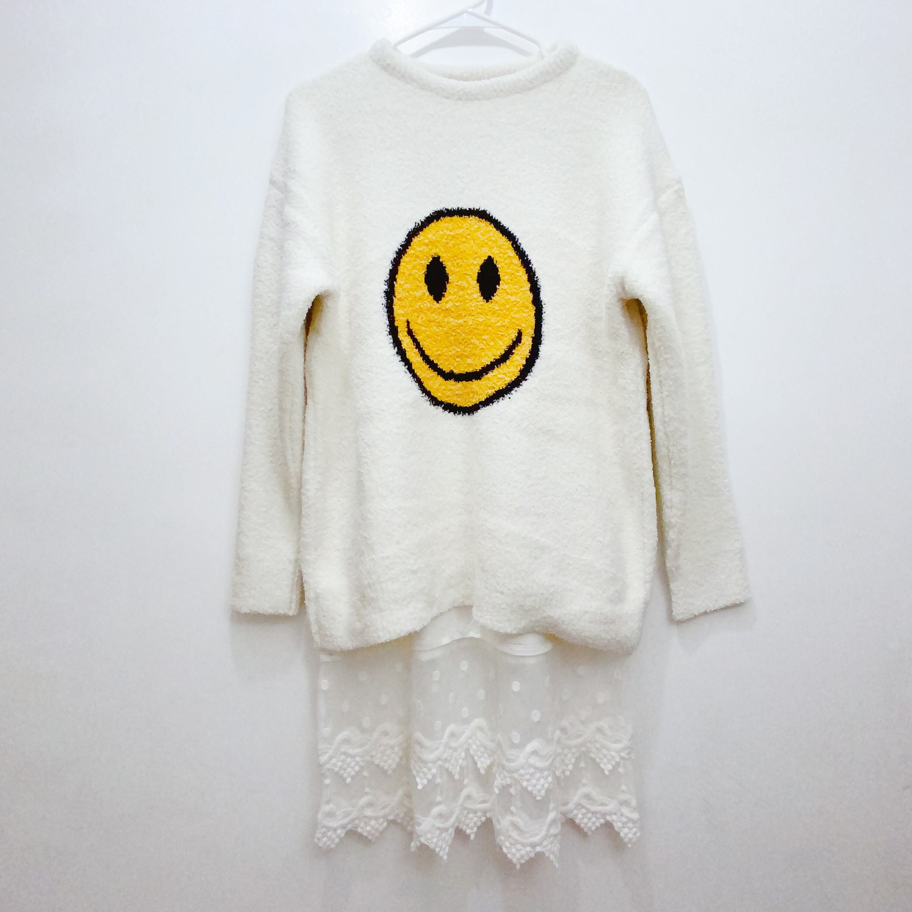 Black sweater with smiley faces sale