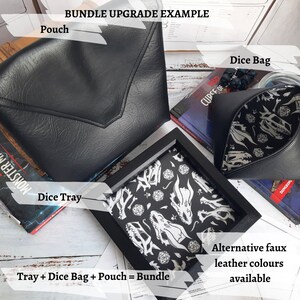May include: A bundle of gaming accessories including a black faux leather dice pouch, a black faux leather dice bag with a dragon skull pattern, and a black framed dice tray with a dragon skull pattern. The text "Bundle Upgrade Example" is at the top of the image. The text "Tray + Dice Bag + Pouch = Bundle" is at the bottom of the image.