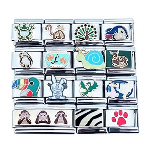 May include: A set of 14 colorful enamel charms featuring various animals, including a frog, monkey, peacock, fish, snail, deer, toucan, bunny, bird, goose, monkeys, zebra, and paw print. The charms are designed for use with Italian charm bracelets.