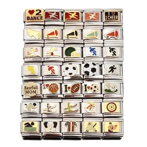 May include: A collection of silver-toned charm bracelets with various sports-themed designs. Charms include footballs, soccer balls, cheerleading megaphones, and the text "Baseball Mom". The charms have colorful enamel accents.