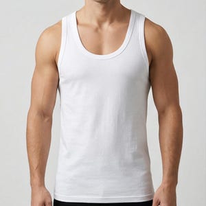 May include: A white vest top with a scoop neckline. The sleeveless shirt is made of a soft, opaque material. The vest top is a basic wardrobe staple.