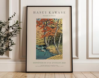 May include: A framed poster advertising an art exhibition titled "Hasui Kawase: Autumn at Oirase". The poster features a Japanese woodblock print depicting a stream flowing through a forest with colorful autumn leaves.