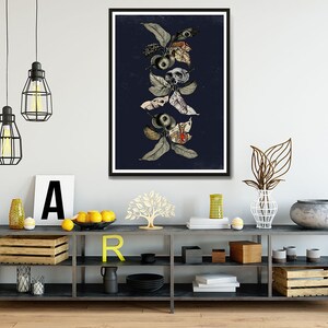 May include: A framed print of a botanical illustration featuring a dark blue background with a vertical arrangement of stylized leaves, flowers, and skulls in shades of gray, white, and red.