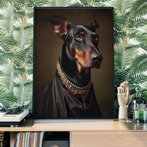 May include: A black and brown Doberman Pinscher dog wearing a silver and pearl necklace and a black velvet robe. The dog is looking to the right of the image.